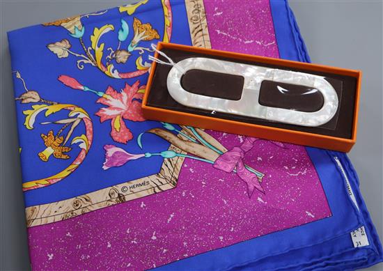 Two Hermes silk scarves, Neige dAntan and Pierres dOrient et dOccident and a Chaine dAncre scarf ring,